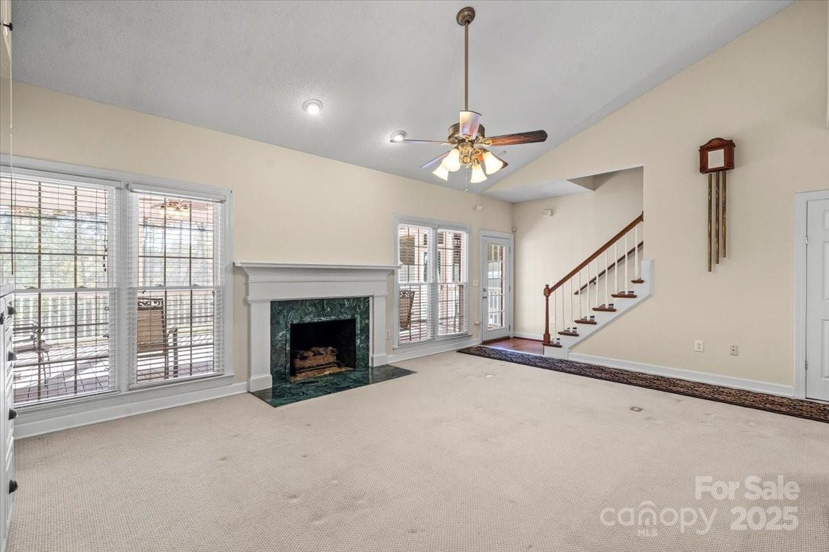 5619 Weddington Road Concord, NC 28027 - Photo 12 of 48 a view of a livingroom with an empty space and fireplace