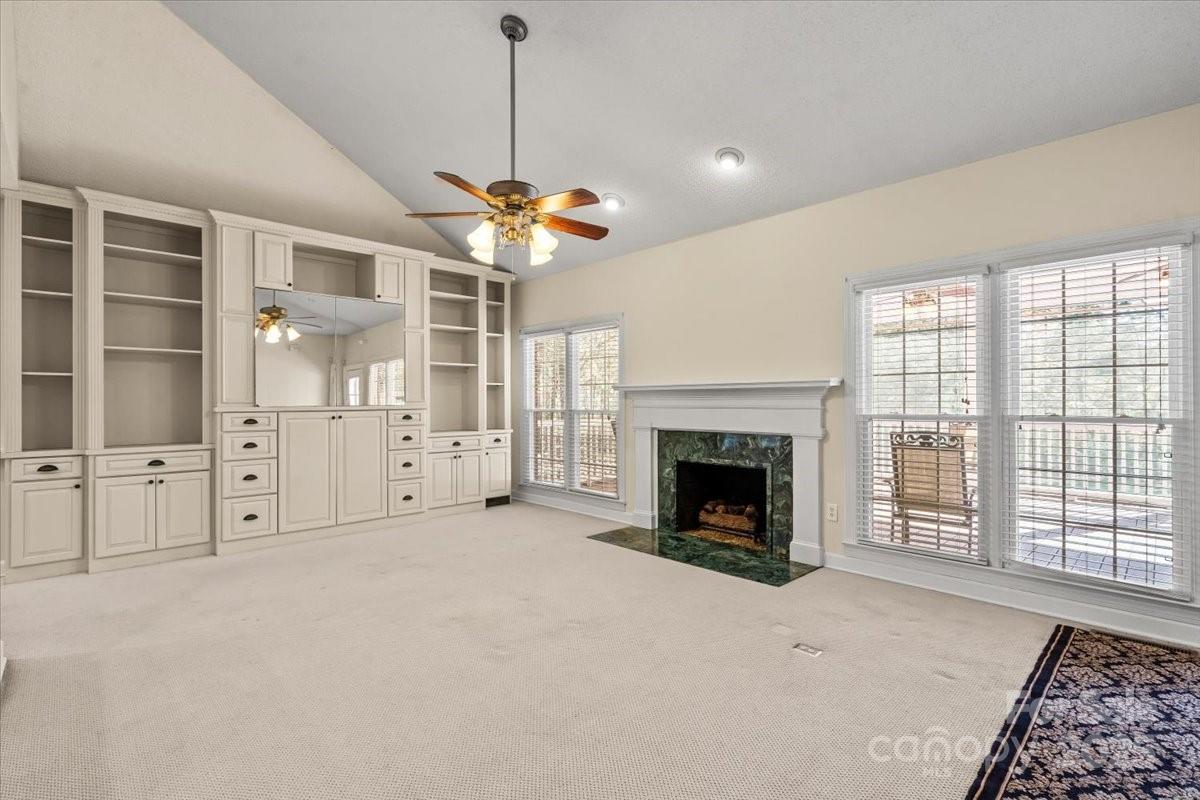 5619 Weddington Road Concord, NC 28027 - Photo 13 of 48 a view of an empty room with a fireplace and a window