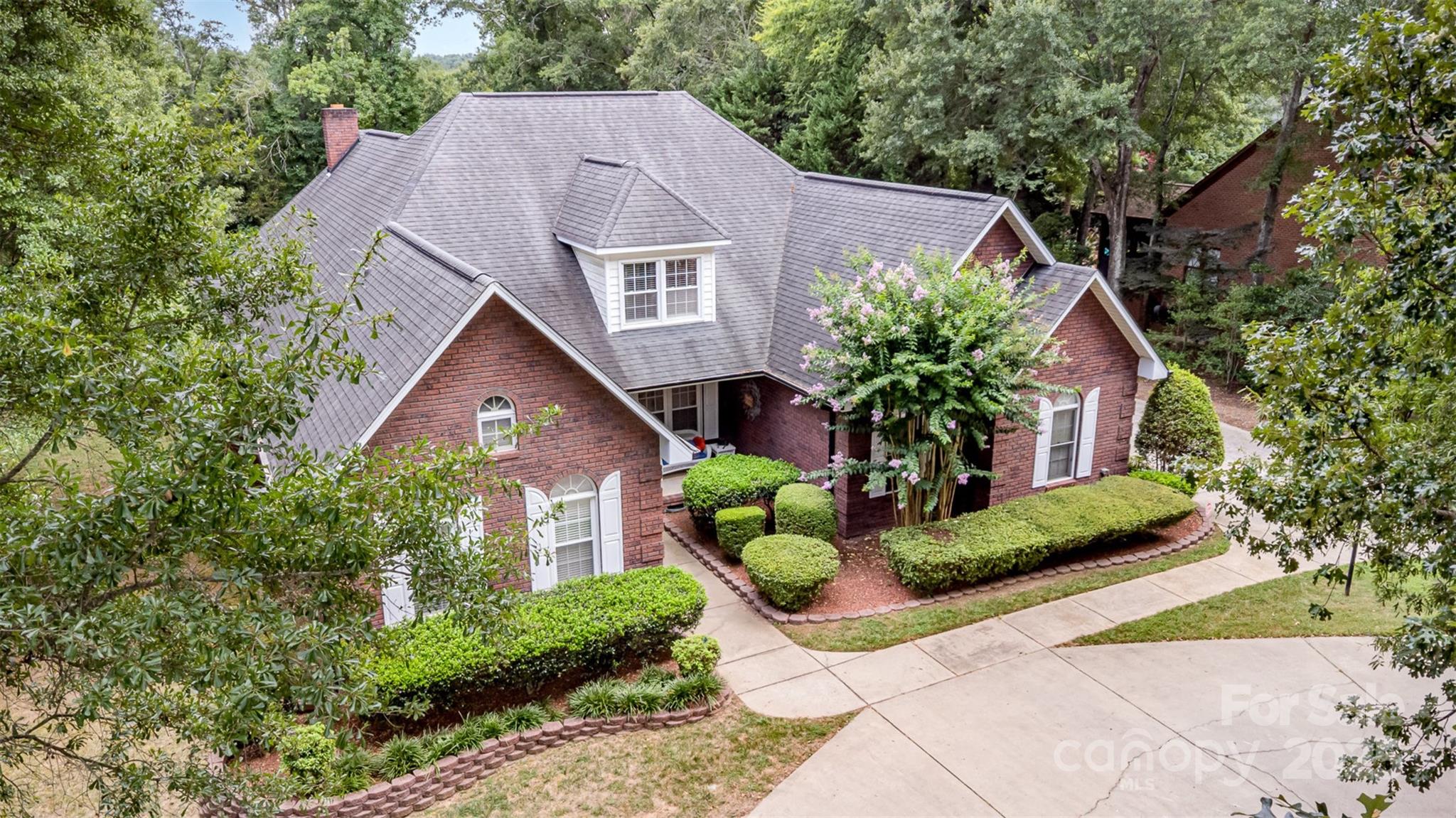 5619 Weddington Road Concord, NC 28027 - Photo 2 of 48 a front view of a house with garden