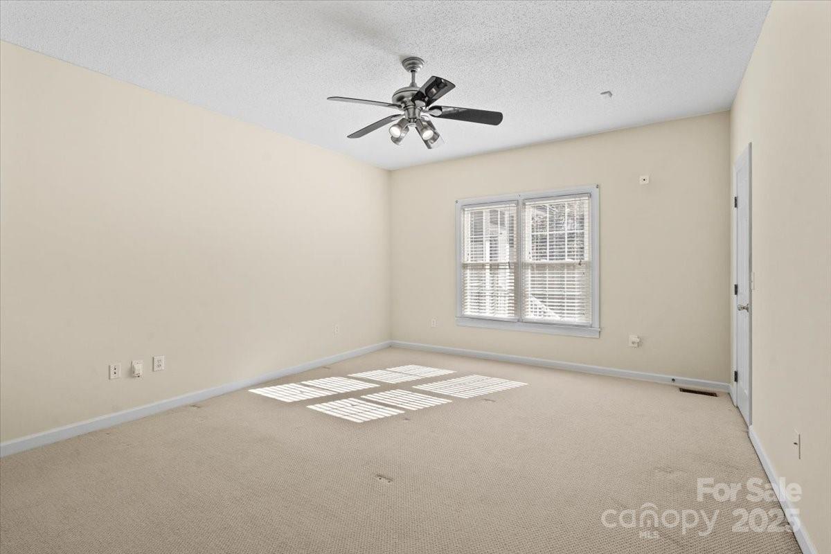 5619 Weddington Road Concord, NC 28027 - Photo 25 of 48 a view of an empty room with a window
