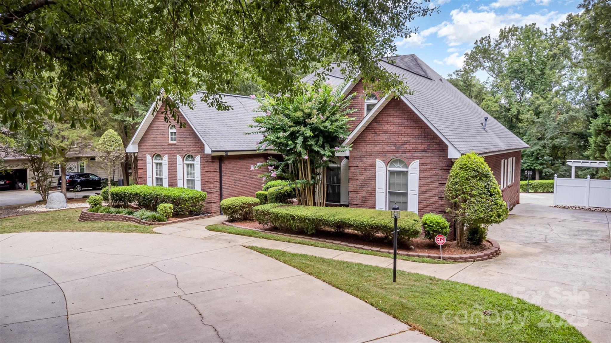 5619 Weddington Road Concord, NC 28027 - Photo 3 of 48 a front view of a house with a yard and potted plants