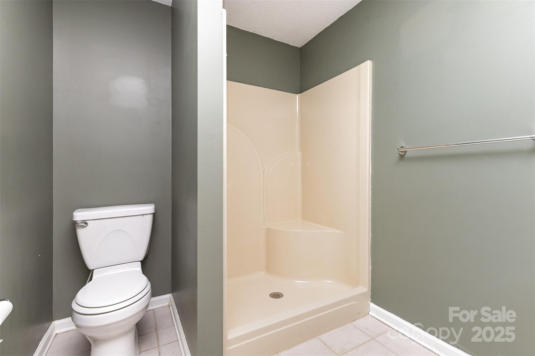 5619 Weddington Road Concord, NC 28027 - Photo 36 of 48 a bathroom with a toilet and shower