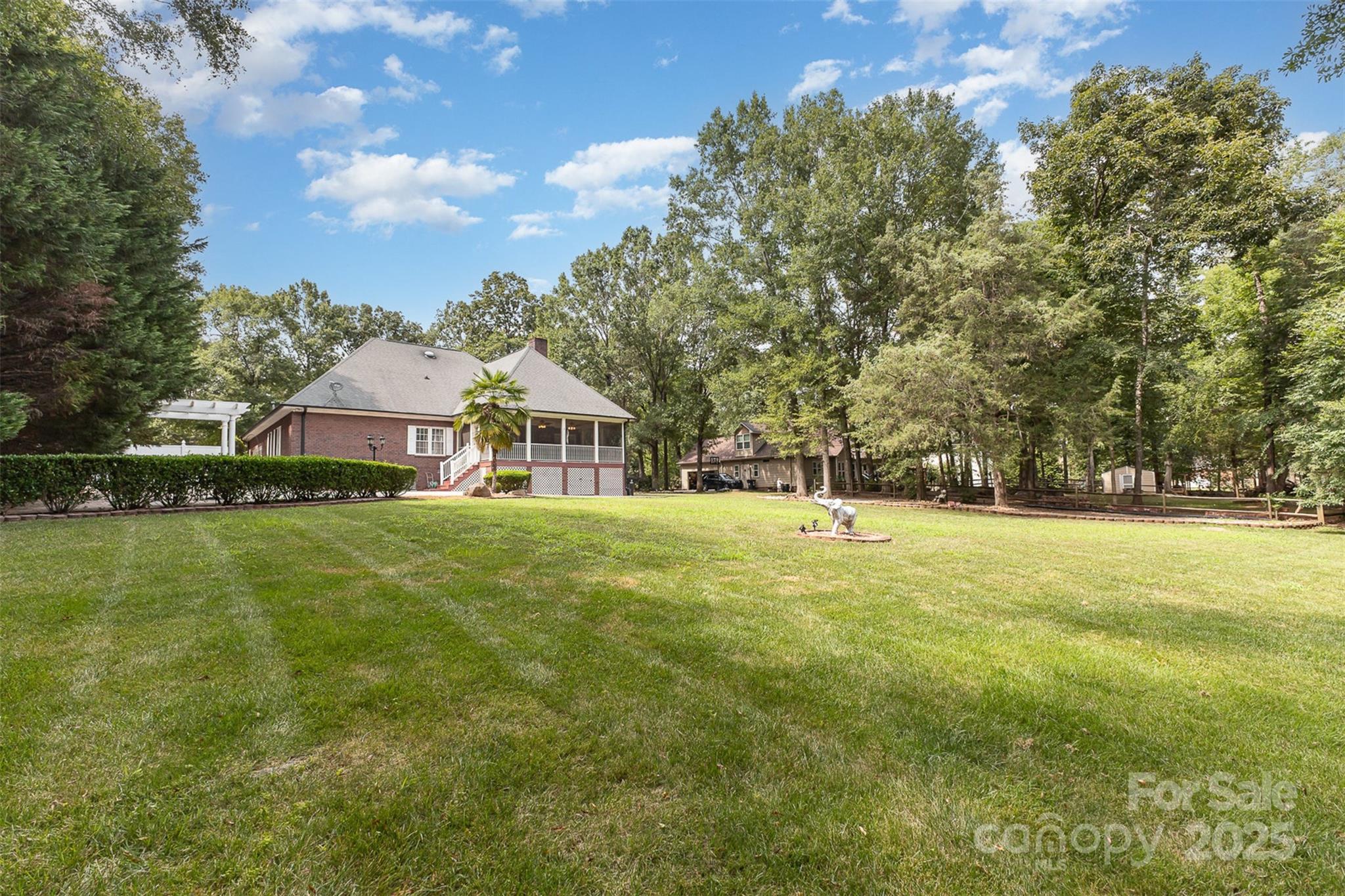 5619 Weddington Road Concord, NC 28027 - Photo 40 of 48 a view of a house with a big yard
