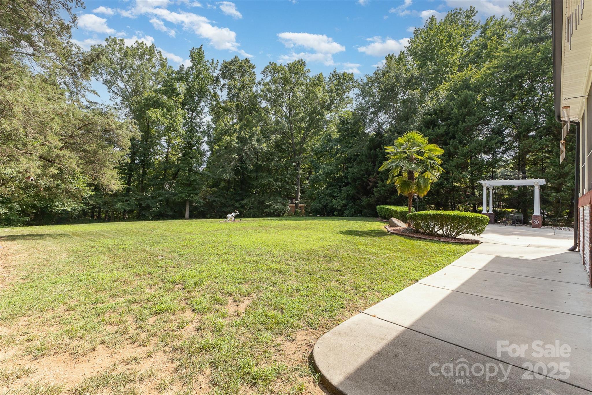 5619 Weddington Road Concord, NC 28027 - Photo 42 of 48 a view of a swimming pool with an outdoor space and seating area