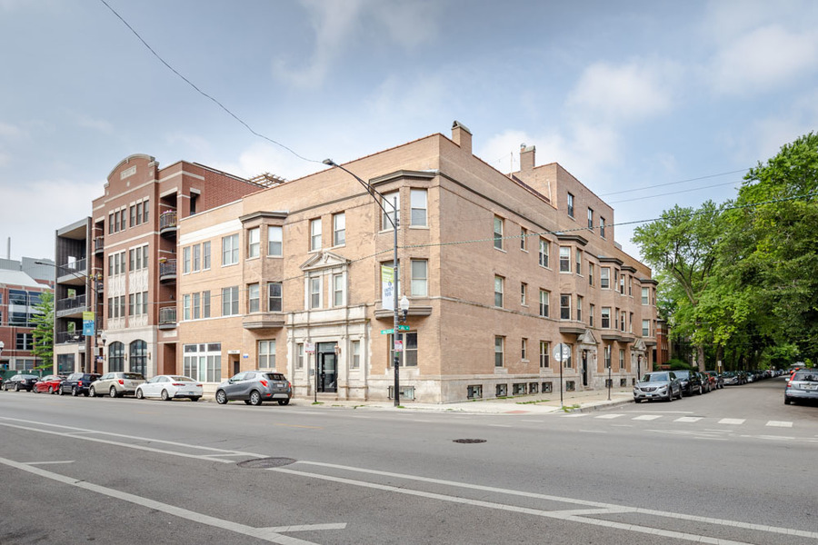 a view of a building with a street