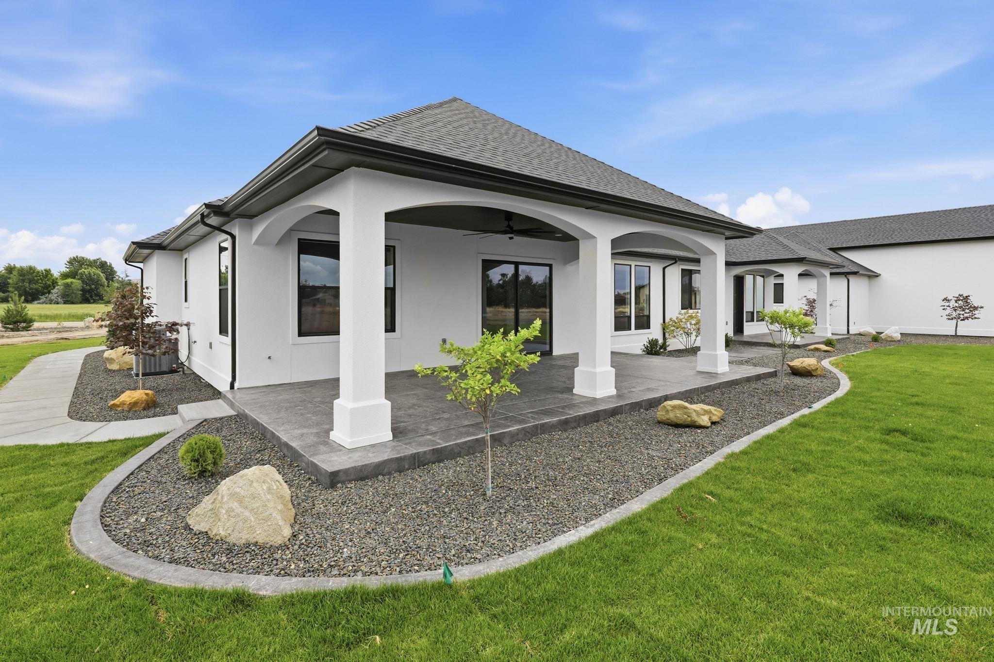 2321 Lower Bluff Road Emmett, ID 83617 - Photo 4 of 31 Contemporary exterior with a white stucco finish and dark trim accents