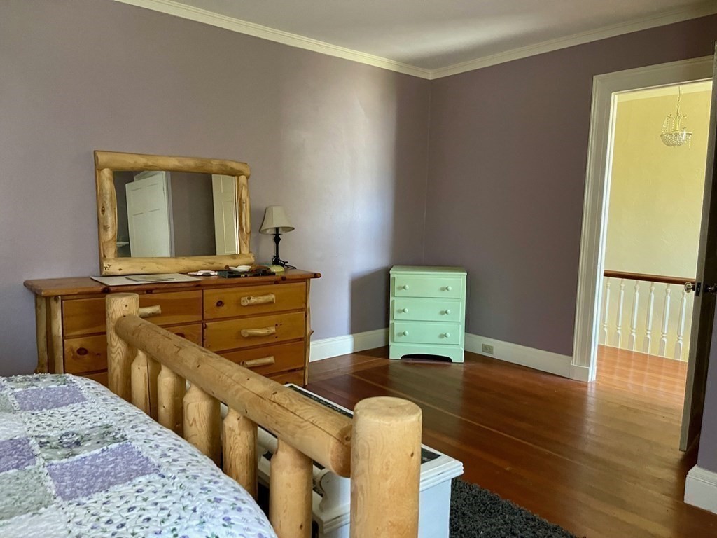 15 Wales Road Brimfield, MA 01010 - Photo 21 of 41 a bedroom with a bed and wooden floor