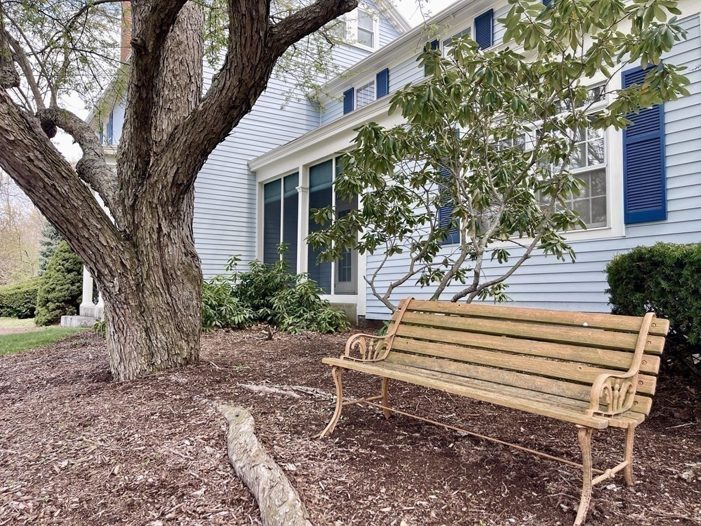 15 Wales Road Brimfield, MA 01010 - Photo 33 of 41 a yellow bench sitting in middle of a yard
