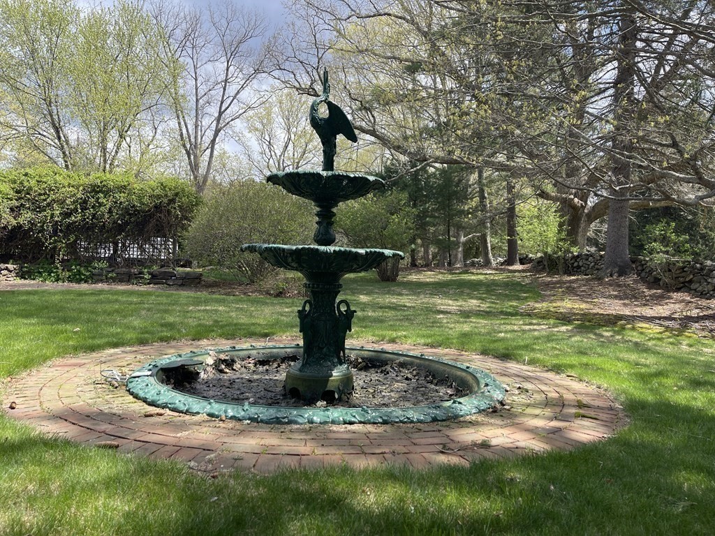 15 Wales Road Brimfield, MA 01010 - Photo 35 of 41 a view of a fountain in the yard with palm trees