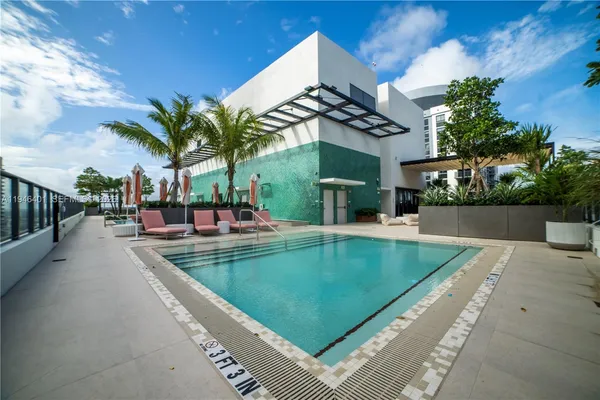 a view of a swimming pool with a patio