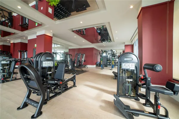 a room with lots of gym equipment