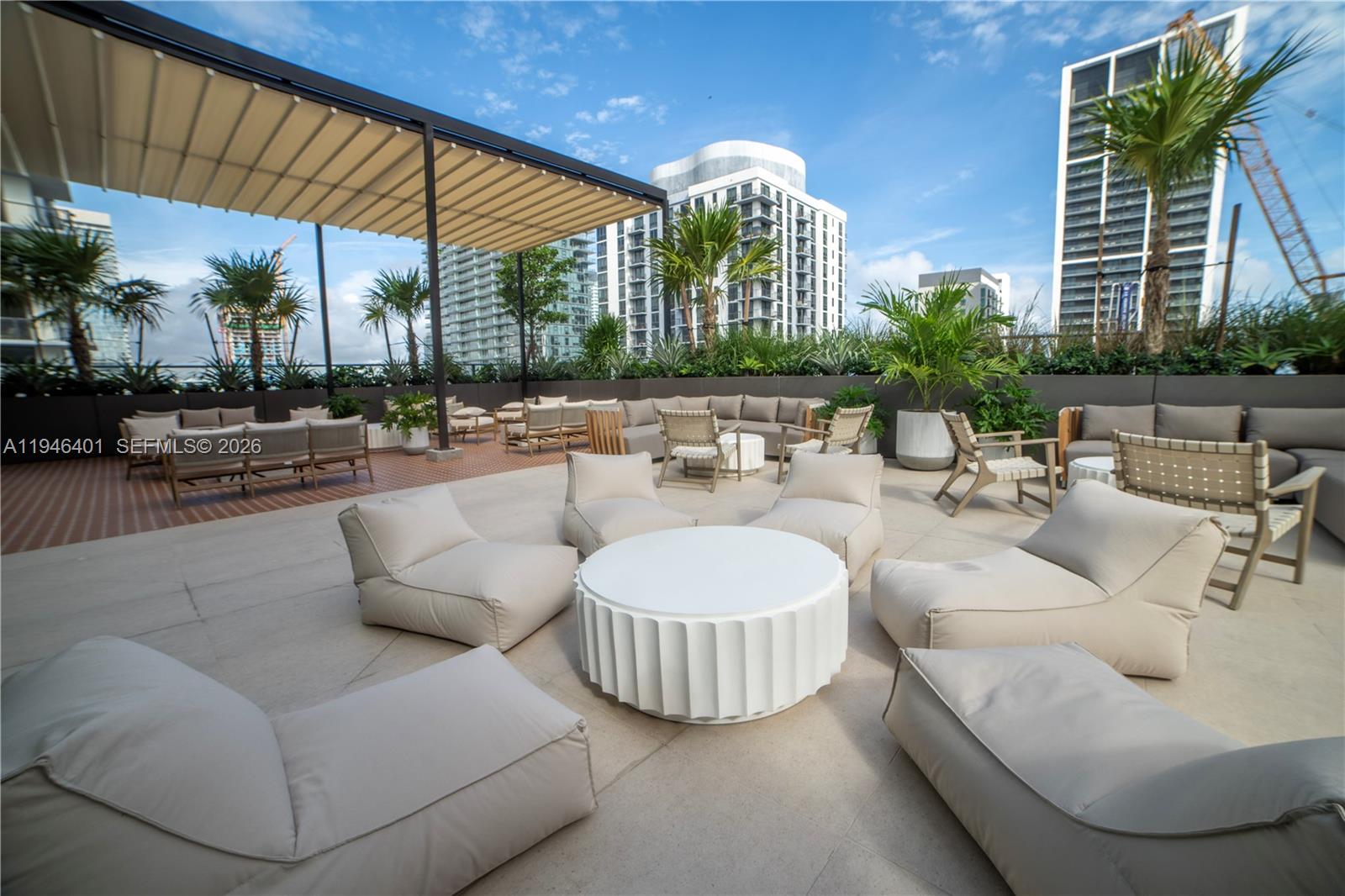 11 Northeast 6th Street, Unit 1908 Miami, FL 33132 - Photo 26 of 38 a view of a patio with couches and a fire pit