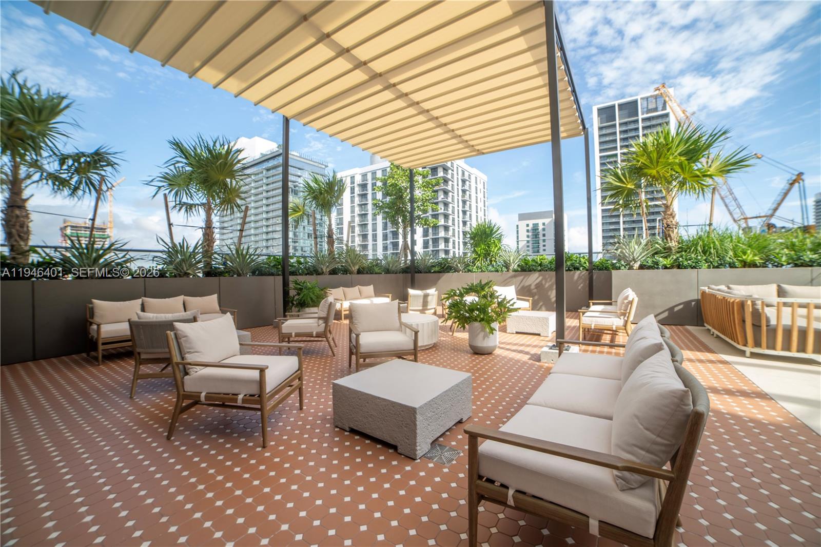 11 Northeast 6th Street, Unit 1908 Miami, FL 33132 - Photo 27 of 38 a view of a patio with couches and potted plants