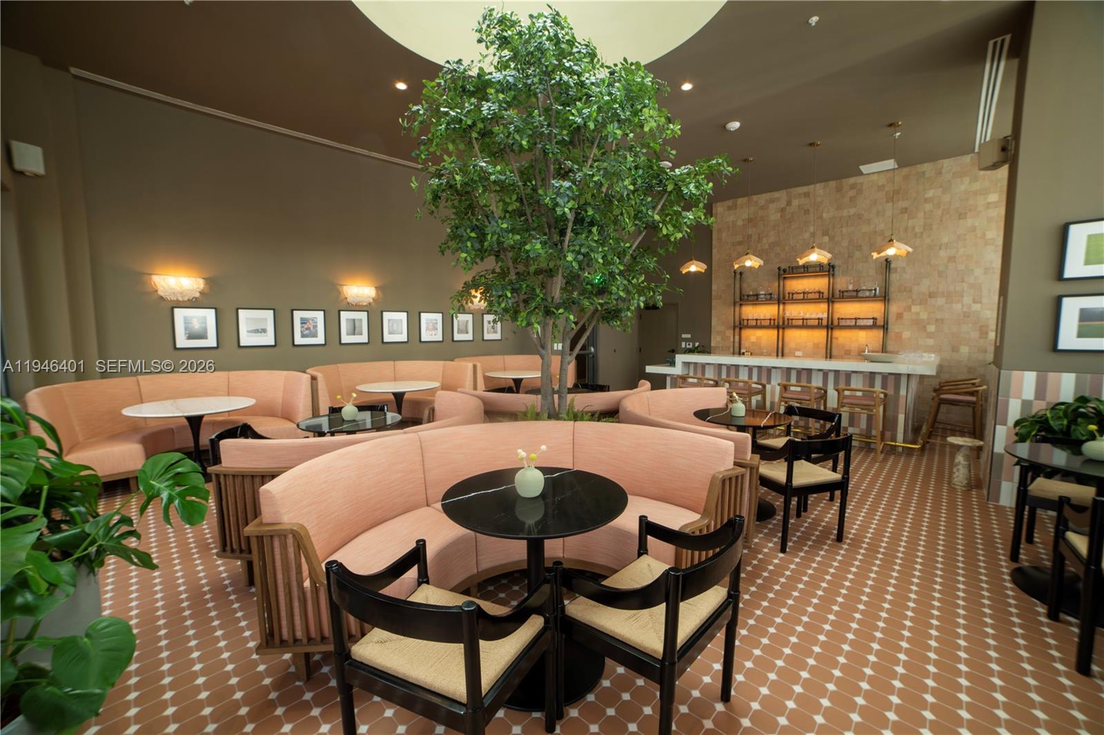 11 Northeast 6th Street, Unit 1908 Miami, FL 33132 - Photo 37 of 38 a dining room with furniture and a potted plant