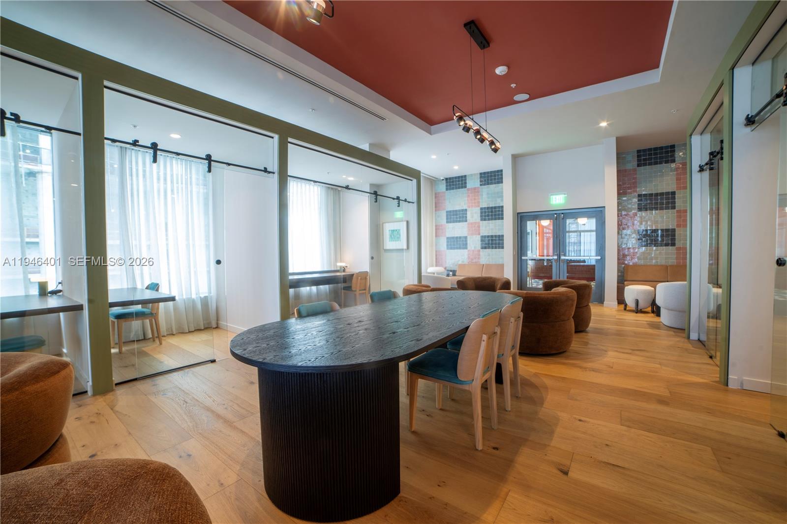 11 Northeast 6th Street, Unit 1908 Miami, FL 33132 - Photo 9 of 38 a living room with couches a table and chairs with wooden floor
