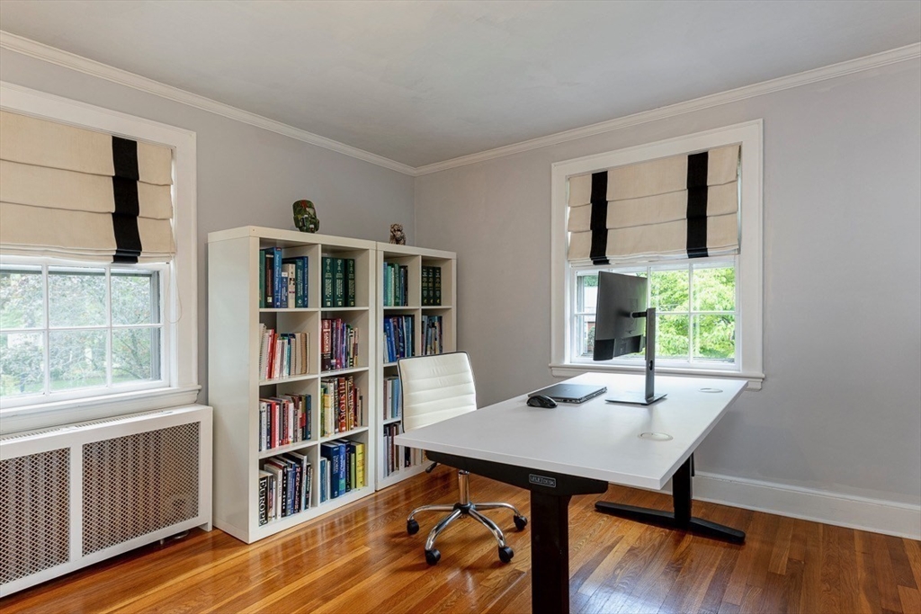 50 Parker Road Wellesley, MA 02482 - Photo 17 of 26 a view of a workspace with furniture bookshelf and a window