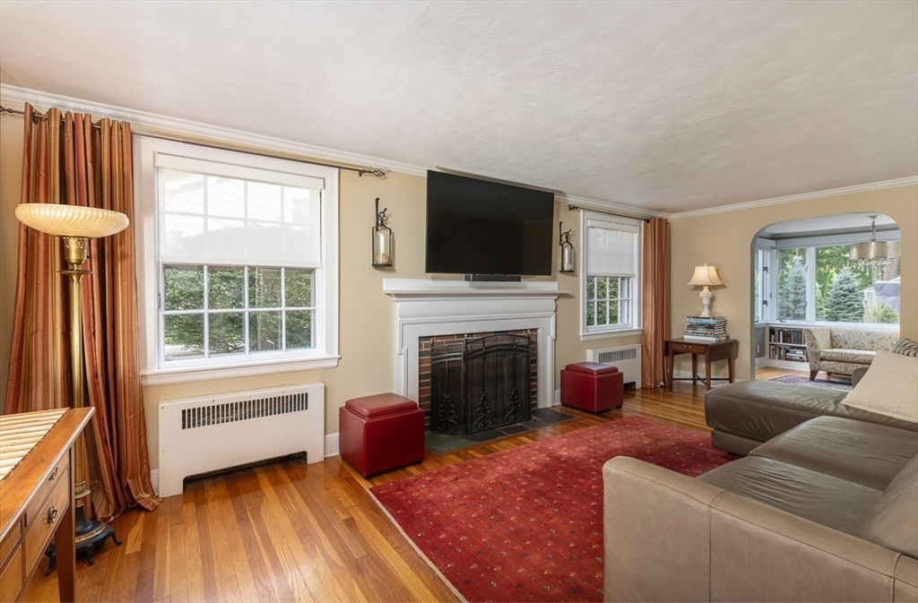 50 Parker Road Wellesley, MA 02482 - Photo 4 of 26 a living room with furniture a flat screen tv and a fireplace