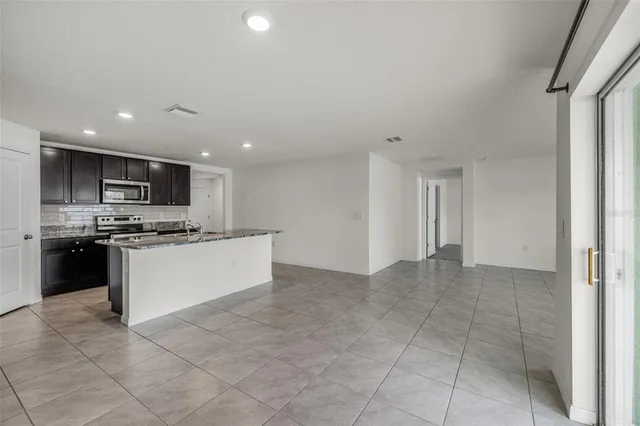 a view of a electric appliances in kitchen and empty room