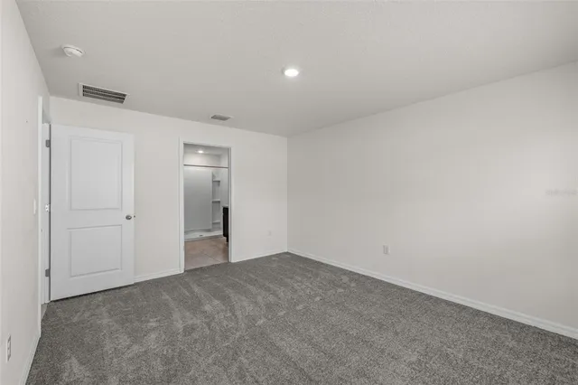 a bathroom with a double vanity sink mirror and shower