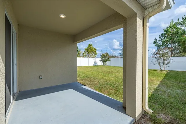 a view of a house with a yard and garage