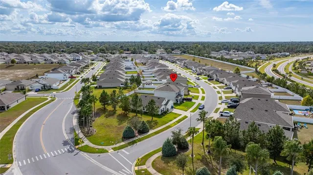 a aerial view of a house with a yard