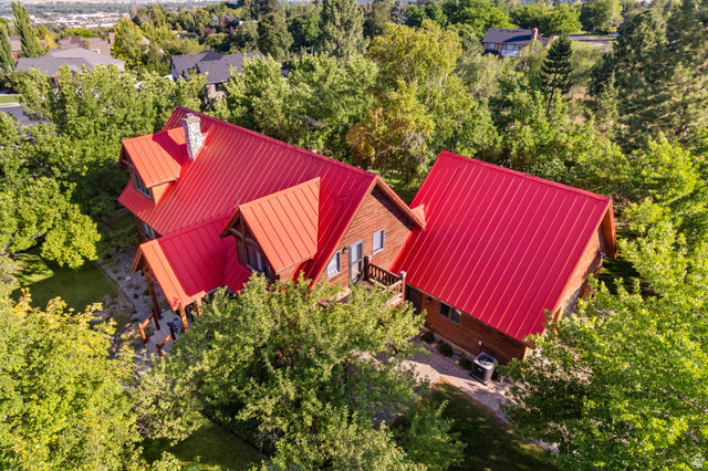 435 Canyon Road Millville, UT 84326 - Photo 112 of 113 Wood-sided home featuring a prominent red metal roof