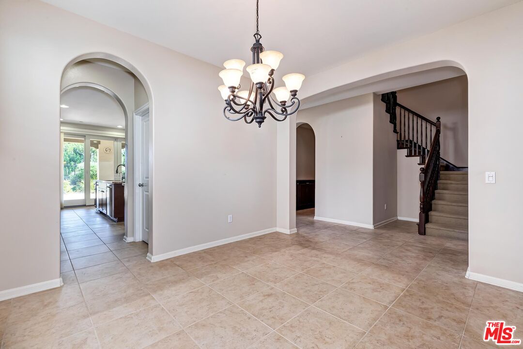 11656 North Ricasoli Way Porter Ranch, CA 91326 - Photo 8 of 51 a view of a chandelier in big room and chandelier