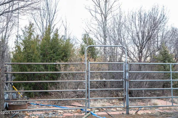 a view of a wooden fence and a window