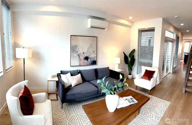 a living room with furniture and a lamp