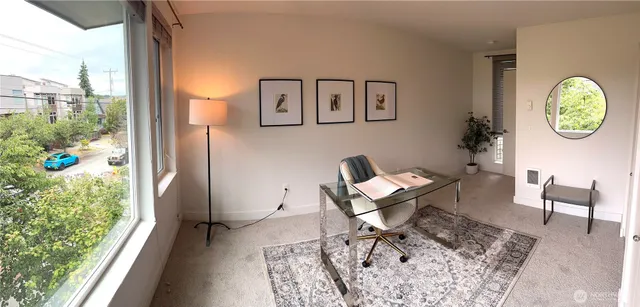 a workspace with furniture and a window