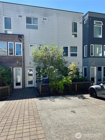 a view of a brick house with a yard