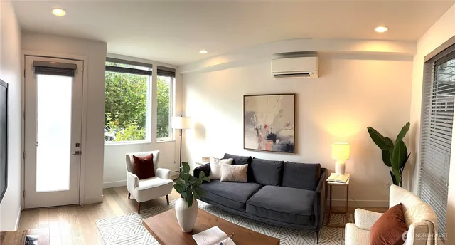 a living room with furniture and a window