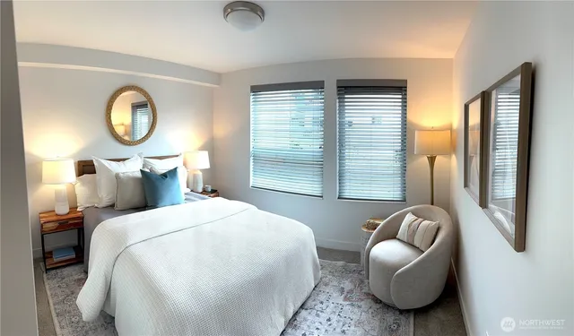 a bedroom with bed and a window