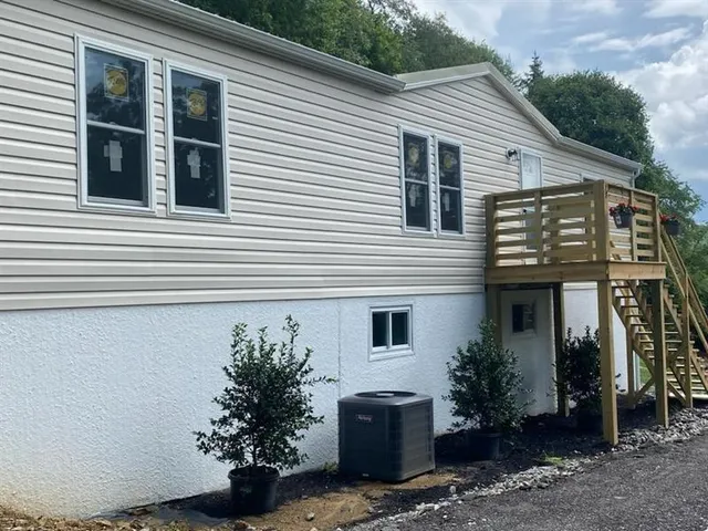 a view of a house with a potted plant