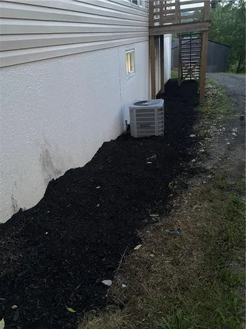 a view of house with backyard and garden