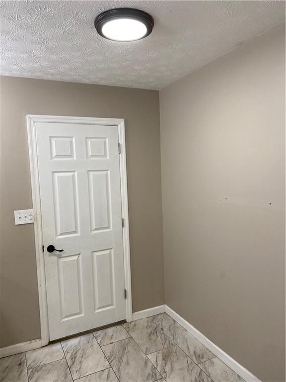 82 Sparta Road Prosperity, PA 15329 - Photo 2 of 14 an empty room with windows