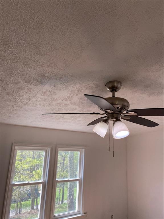 82 Sparta Road Prosperity, PA 15329 - Photo 3 of 14 a view of room with a window and a ceiling fan