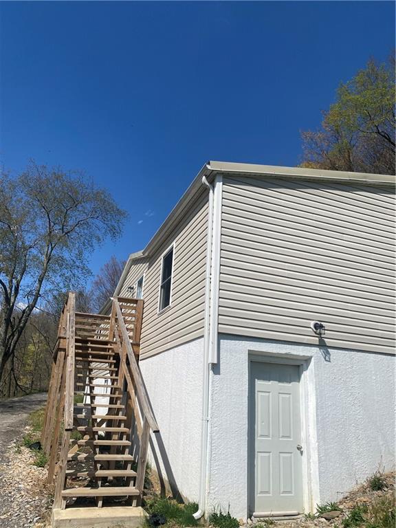 82 Sparta Road Prosperity, PA 15329 - Photo 4 of 14 a view of a balcony with wooden floor and fence