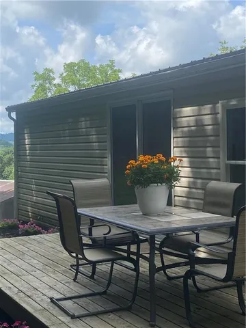a view of a deck with furniture