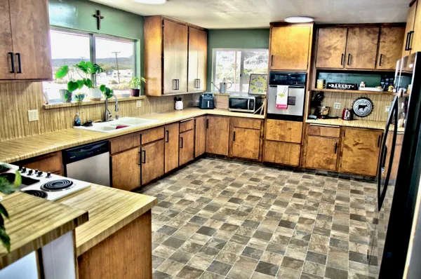a kitchen with a sink stove and window