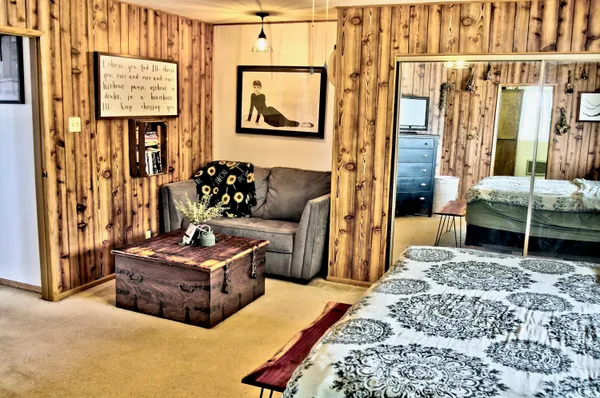 a bedroom with furniture and window