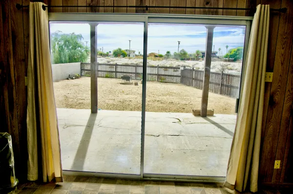 a view of a dining room with furniture window and outside view