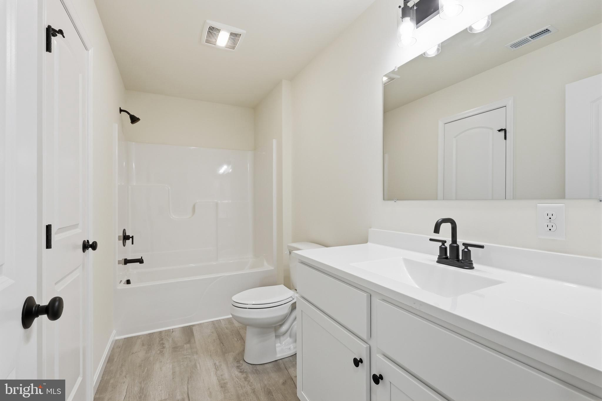 1354 College Road Dover, DE 19904 - Photo 33 of 46 a bathroom with a sink toilet and shower