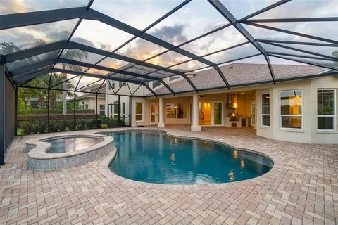 a large kitchen with stainless steel appliances granite countertop a stove and a sink
