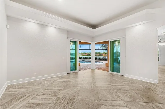 a kitchen with stainless steel appliances granite countertop a sink stove refrigerator and cabinets