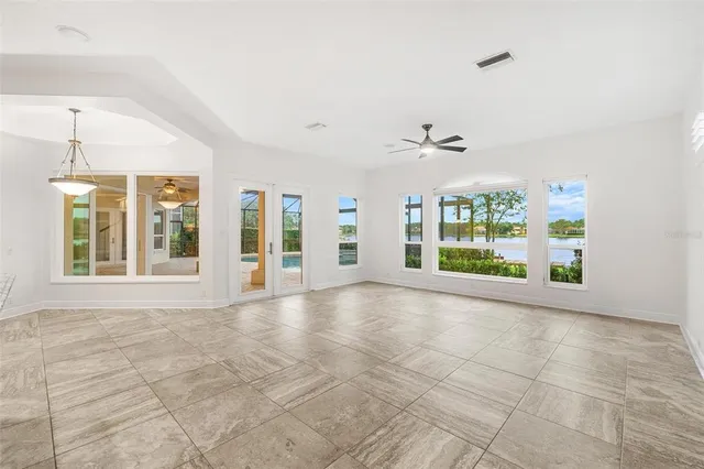 an empty room with windows and closet
