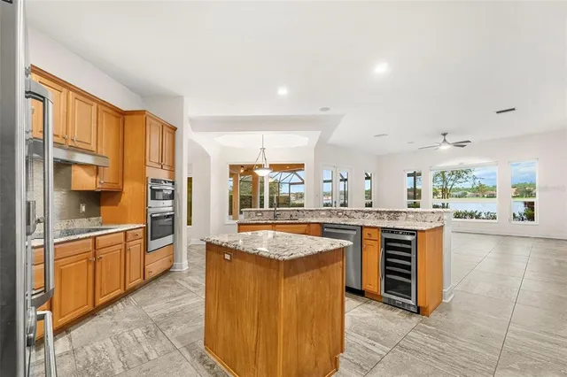 a spacious bathroom with a tub sink and a mirror