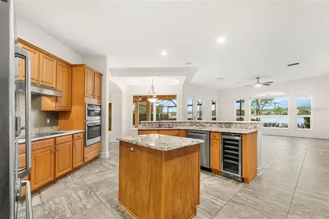 an empty room with entrance and windows
