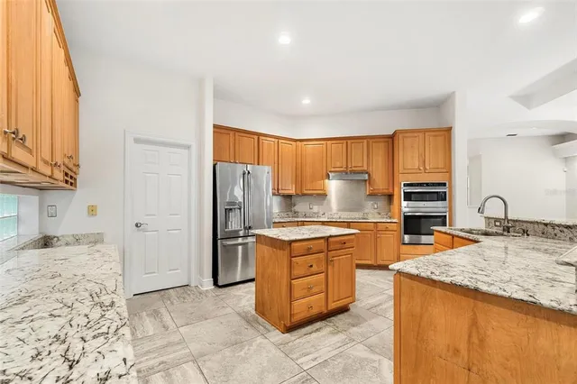 an empty room with entrance and windows