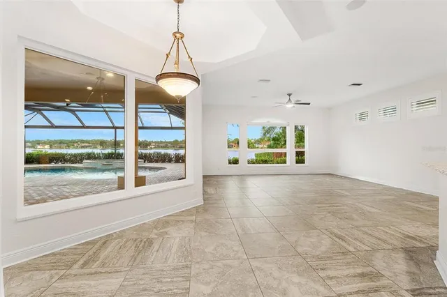 a bathroom with a bathtub a double vanity sink and mirrors